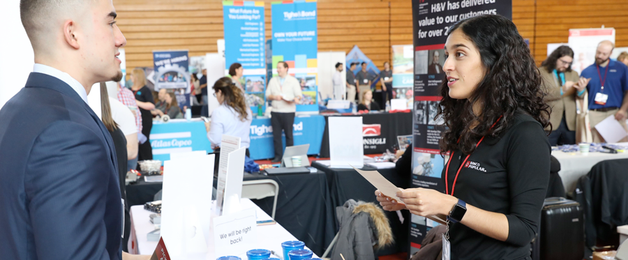 Student and potential employer speaking at the RPI Career Fair