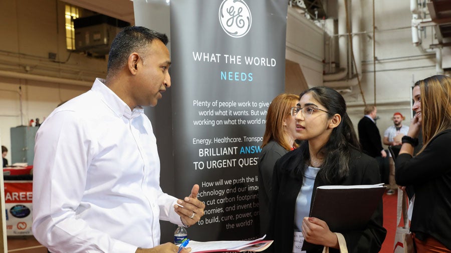 GE Representive talks with student at RPI Career Fair